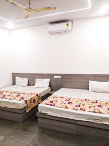 Katil atau katil-katil dalam bilik di Hotel Prem Chaya