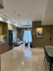 a living room with a couch and a table at Japandi Serenity 1 king,1 queen,1 single bed 5pax in Medan +3 photos
