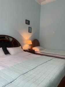 Voodi või voodid majutusasutuse Holiday House toas