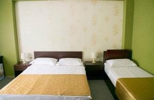 Postel nebo postele na pokoji v ubytování Hotel Rosa