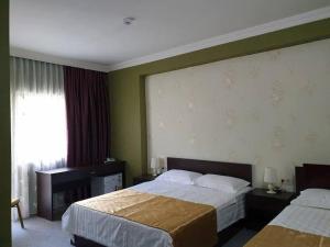 Postel nebo postele na pokoji v ubytování Hotel Rosa