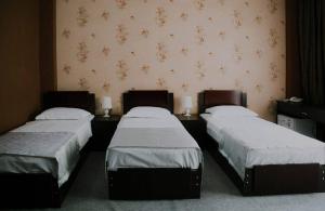 Postel nebo postele na pokoji v ubytování Hotel Rosa