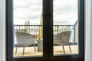 MASEVEN Frankfurt Messe的阳台或露台