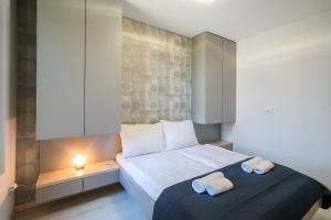 Posteľ alebo postele v izbe v ubytovaní MyFlat Casa Galerius Apartment