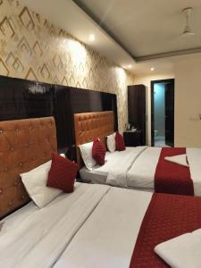 Voodi või voodid majutusasutuse P S Grand By Iconic Near Delhi International Airport toas