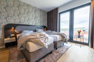 MASEVEN Frankfurt Messe客房内的一张或多张床位
