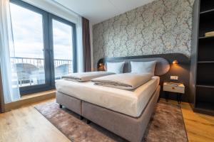 MASEVEN Frankfurt Messe客房内的一张或多张床位