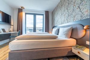 MASEVEN Frankfurt Messe客房内的一张或多张床位