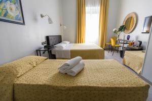 Postel nebo postele na pokoji v ubytování Hotel Ponte Sassi