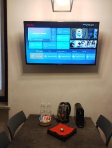 Μια τηλεόραση ή/και κέντρο ψυχαγωγίας στο I Portici - Bergamo Apartment