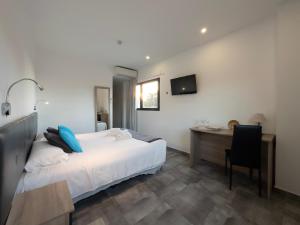 Postel nebo postele na pokoji v ubytování Hotel Portmán