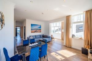 O zonă de relaxare la Ferienwohnung Schilfrohr Meerblick Kamin Sauna