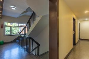 a hallway with a staircase and a stair case at Hotel Sapana Garden Thamel in Kathmandu