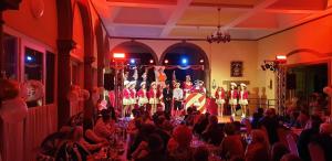 a group of people on a stage in a room at Eifeler Hof - Ihr Restaurant für Genussmomente in Kyllburg in Kyllburg