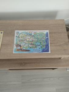 a wooden table with a map of the united states at 4 Rooms Apartment in Tulcea