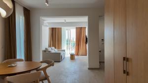 a living room with a table and a couch at Alpesa Apartments in Budva