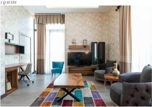 a living room with a couch and a table at Tryp by Wyndham Istanbul Topkapi in Istanbul