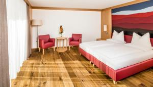 Postel nebo postele na pokoji v ubytování Hotel Hasslhof