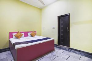 Postel nebo postele na pokoji v ubytování Hotel O Hr Residency
