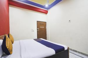 Postel nebo postele na pokoji v ubytování Hotel O Hr Residency