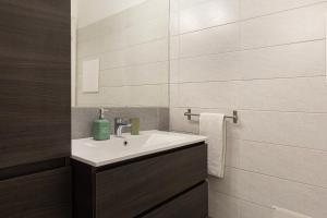a bathroom with a sink and a mirror at Tata's Home in Cernobbio +14 photos