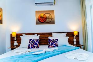 Postel nebo postele na pokoji v ubytování Villa Bako Hôtel + 25 fotografií