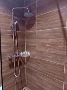 a shower with a glass door in a bathroom at Ada Bojana Beach House I XXL TerraceI BBQ I Betw BridgeBeach I Air Con in Ulcinj