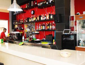 The lounge or bar area at Alcaravaneras Hostel
