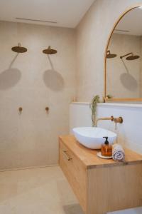 a bathroom with a sink and a mirror at Villa Alora in Exmouth +31 photos