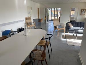 a living room with a table and chairs and a couch at The old bank in Sønderborg