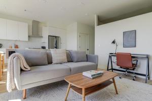 a living room with a couch and a table at Blueground Round Rock pool nr Old Settlers Park ATX-318 in Austin