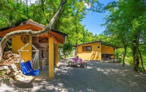 a house with a hammock in front of it at Casa Silente Opatija by Villas Guide in Lovran