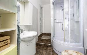 a bathroom with a shower and a sink and a toilet at Casa Silente Opatija by Villas Guide in Lovran +16 photos