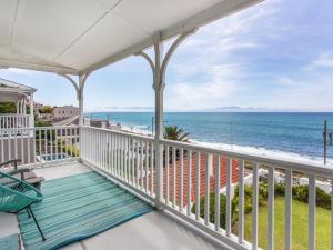 a balcony with a view of the ocean at St James Beachfront Villa in St James