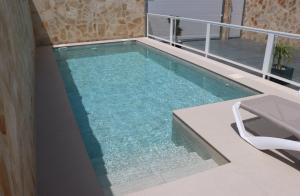 a swimming pool on the roof of a house at Casa el rincon de la Rosa II in Conil de la Frontera