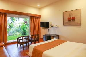 Ένα ή περισσότερα κρεβάτια σε δωμάτιο στο Shoonya Farm Retreat