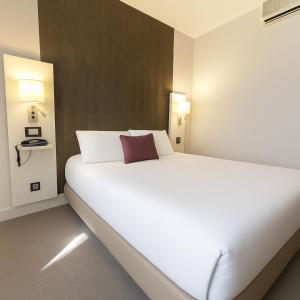 Postel nebo postele na pokoji v ubytování Hôtel Albert Elisabeth Gare SNCF