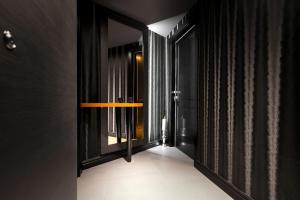 a hallway with a window with a light on it at DeZign Superior Apartments & Rooms in Zadar