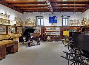 a room filled with lots of different types of vehicles at B&B Bela Vrba in Bačko Novo Selo