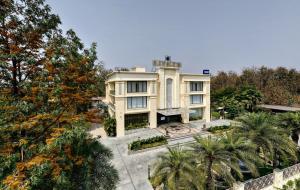 an aerial view of a house with trees at Pinaka Hotels & Resorts in Haridwār