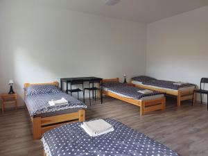 Postel nebo postele na pokoji v ubytování Apartmány Kortan