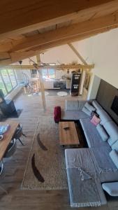 a living room with a couch and a table at Planinska kuća Bajni 