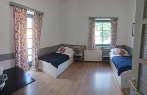 Postel nebo postele na pokoji v ubytování Abbázia Club Hotel Kék