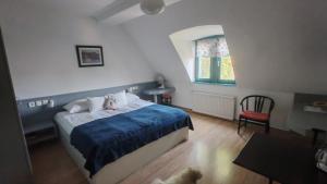 Postel nebo postele na pokoji v ubytování Abbázia Club Hotel Kék