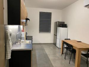 Kuchyň nebo kuchyňský kout v ubytování Apartmány Kortan + 16 fotografií