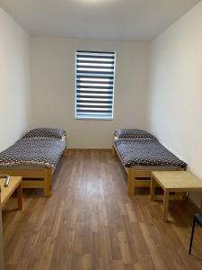 Postel nebo postele na pokoji v ubytování Apartmány Kortan