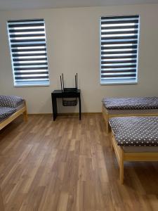 Postel nebo postele na pokoji v ubytování Apartmány Kortan