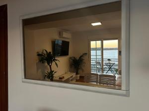 TV a/nebo společenská místnost v ubytování AYAMONTE Sunset