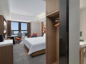 Voodi või voodid majutusasutuse Hampton by Hilton Chengdu Wuhou Waishuannan toas