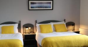 Rúm í herbergi á Ferryport House B&B